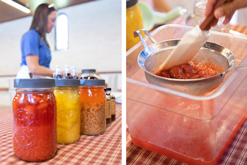 Left: A person stands near a table displaying jars of shrubs. Right: a spatula is used to press fruit through a metal strainer over a plastic container.